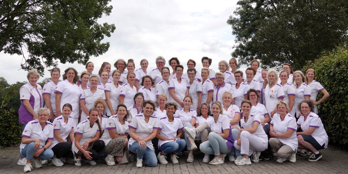 Eindejaarsgroet en groepsfoto Carinova